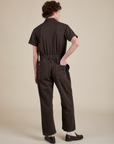 Short Sleeve Jumpsuit in Espresso Brown back view on Quinn