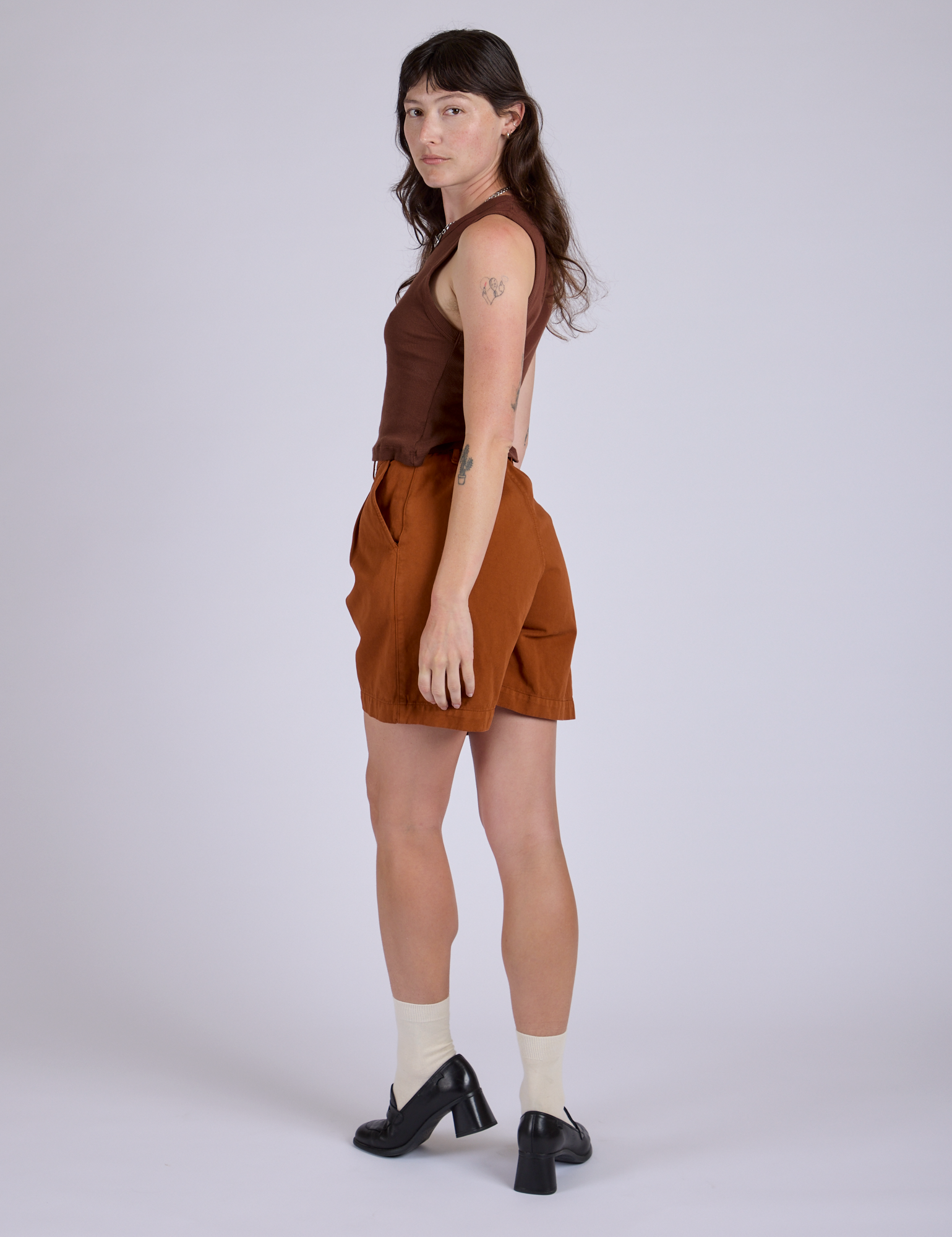 Pleated Trouser Shorts in Burnt Terracotta angled back view on Alex