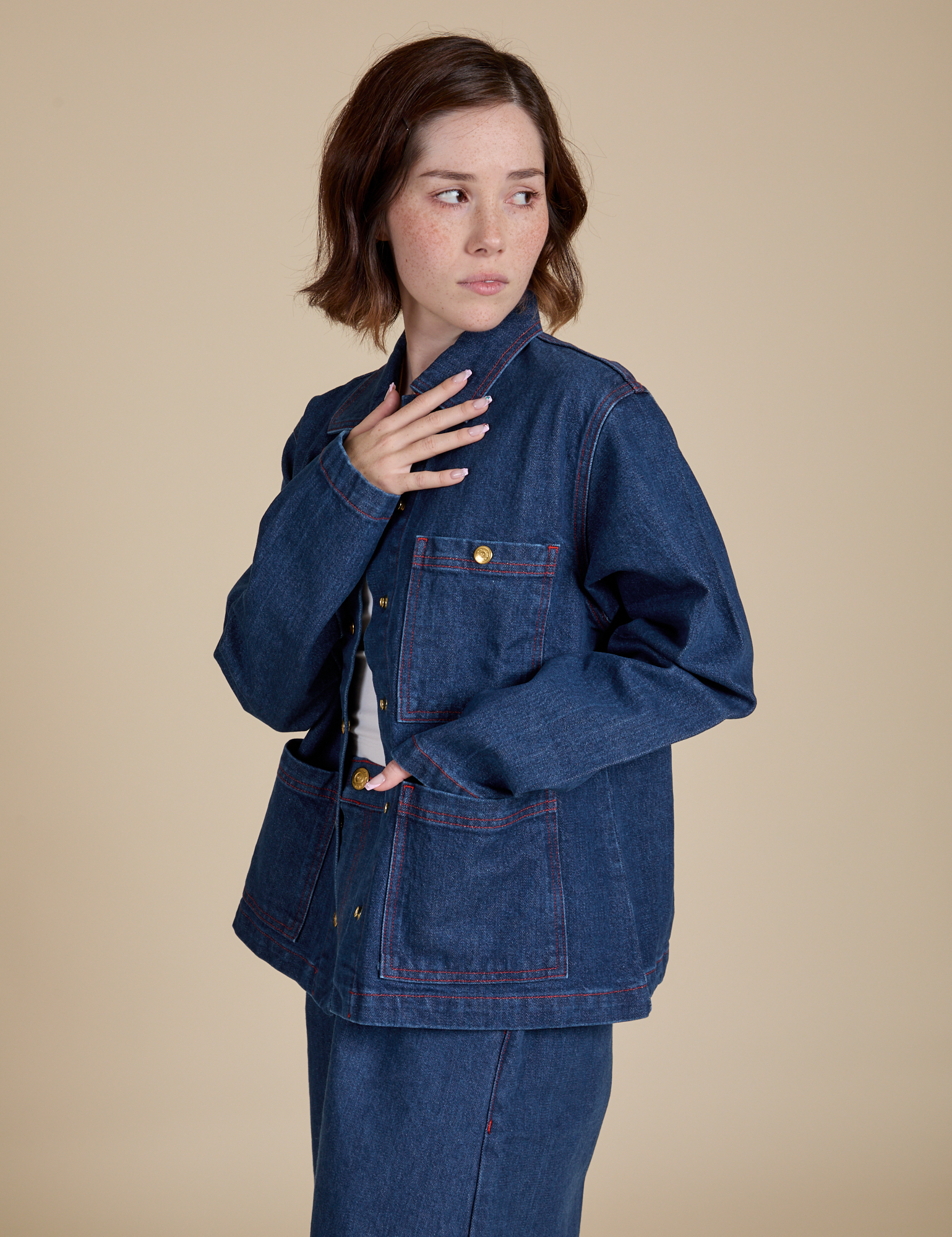 Angled front view of Indigo Denim Work Jacket in Dark Wash on Hana