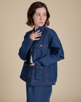 Angled front view of Indigo Denim Work Jacket in Dark Wash on Hana
