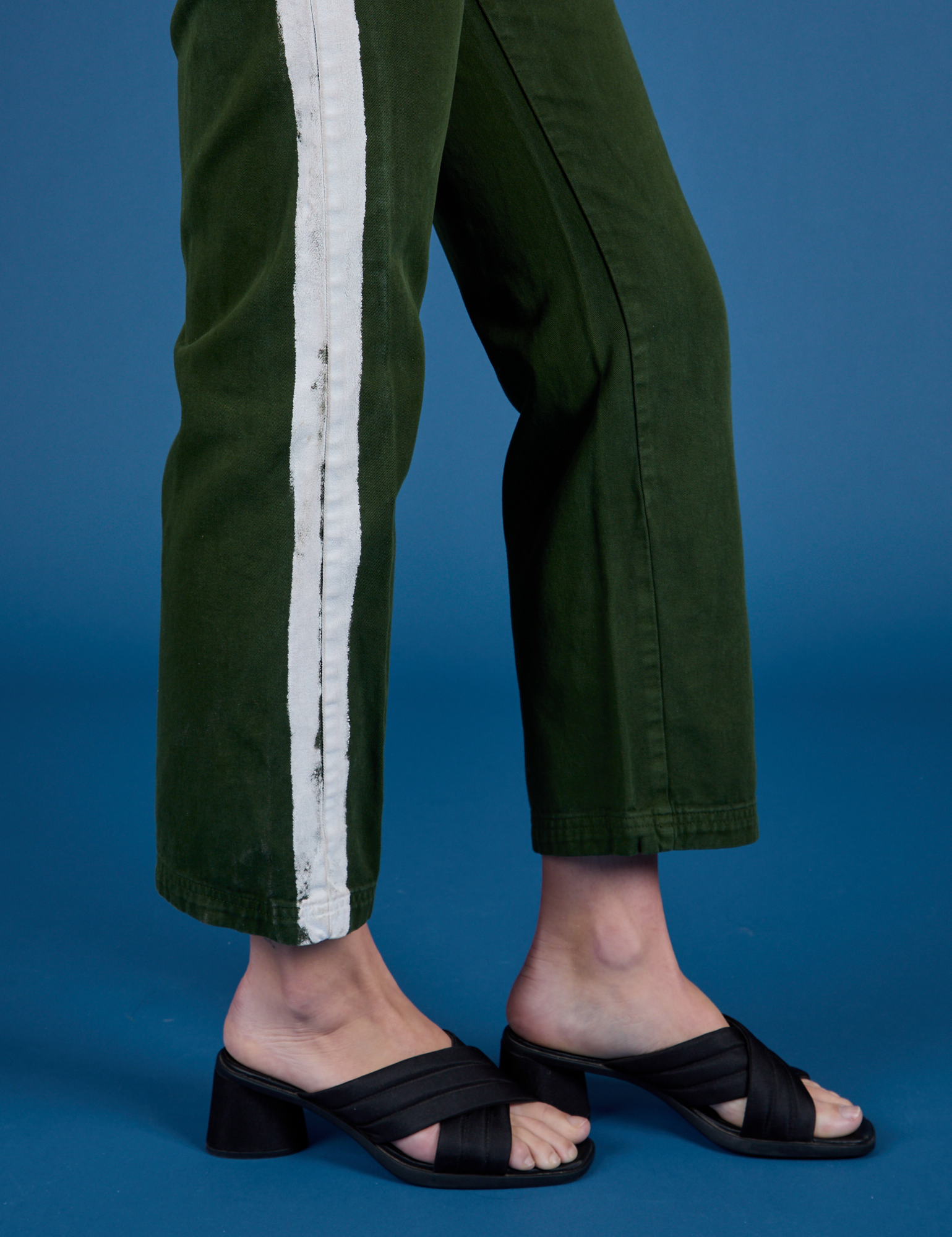 Painted Work Pants in Evergreen pant leg side view close up on Alex