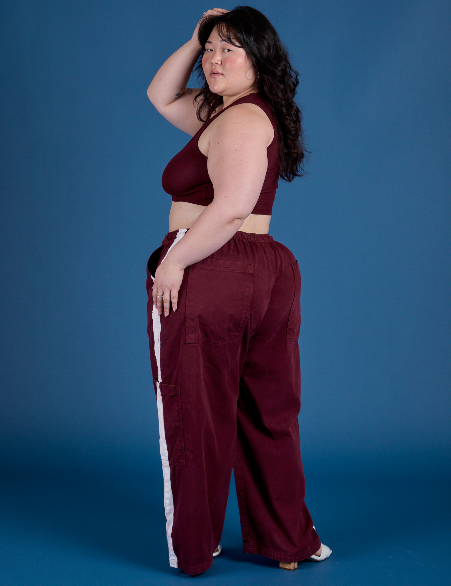Painted Drop Pocket Cargo Pants in Red Wine angled back view on Ashley