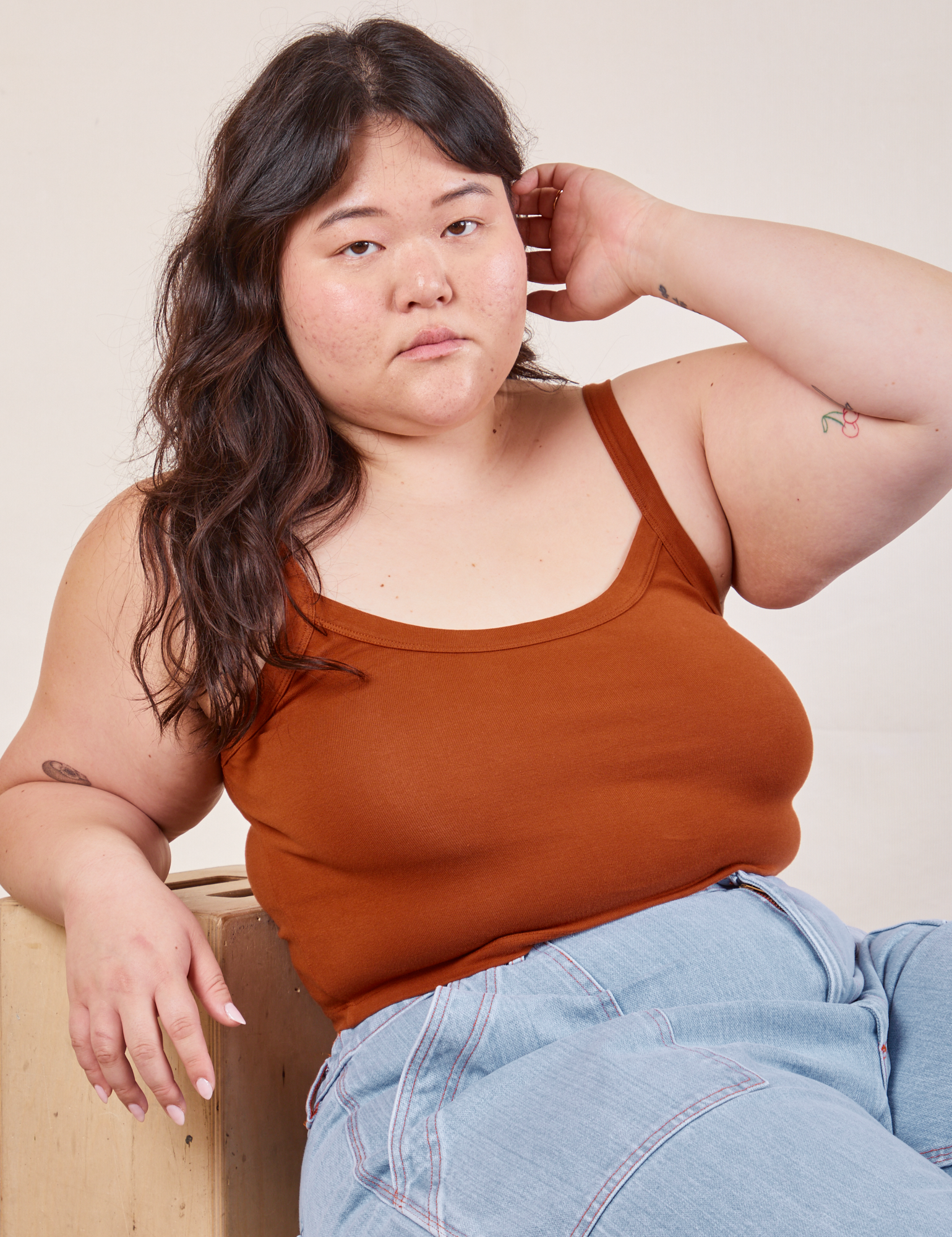 Ashley is wearing Cropped Cami in Burnt Terracotta