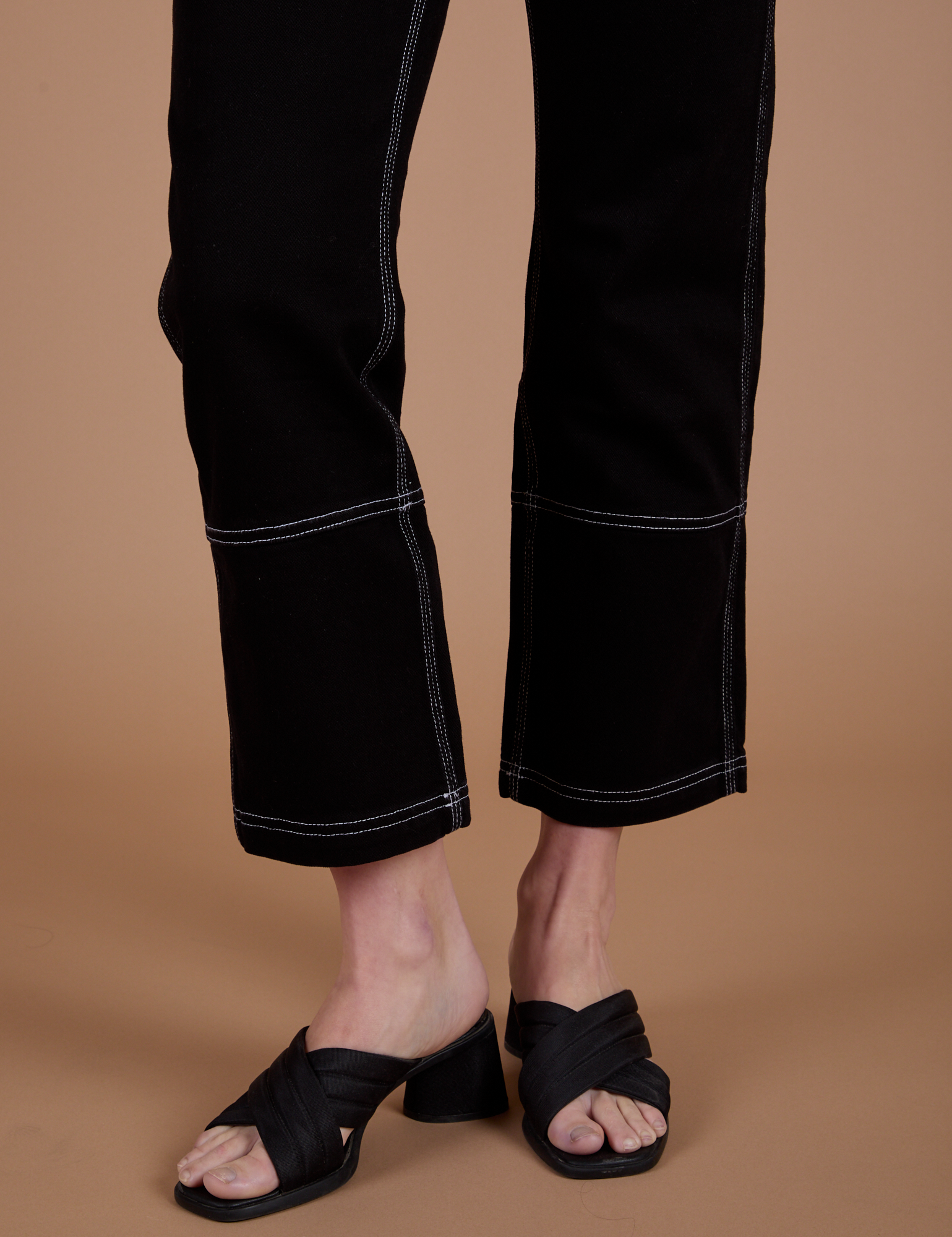 Carpenter Jeans in Black pant leg close up on Alex
