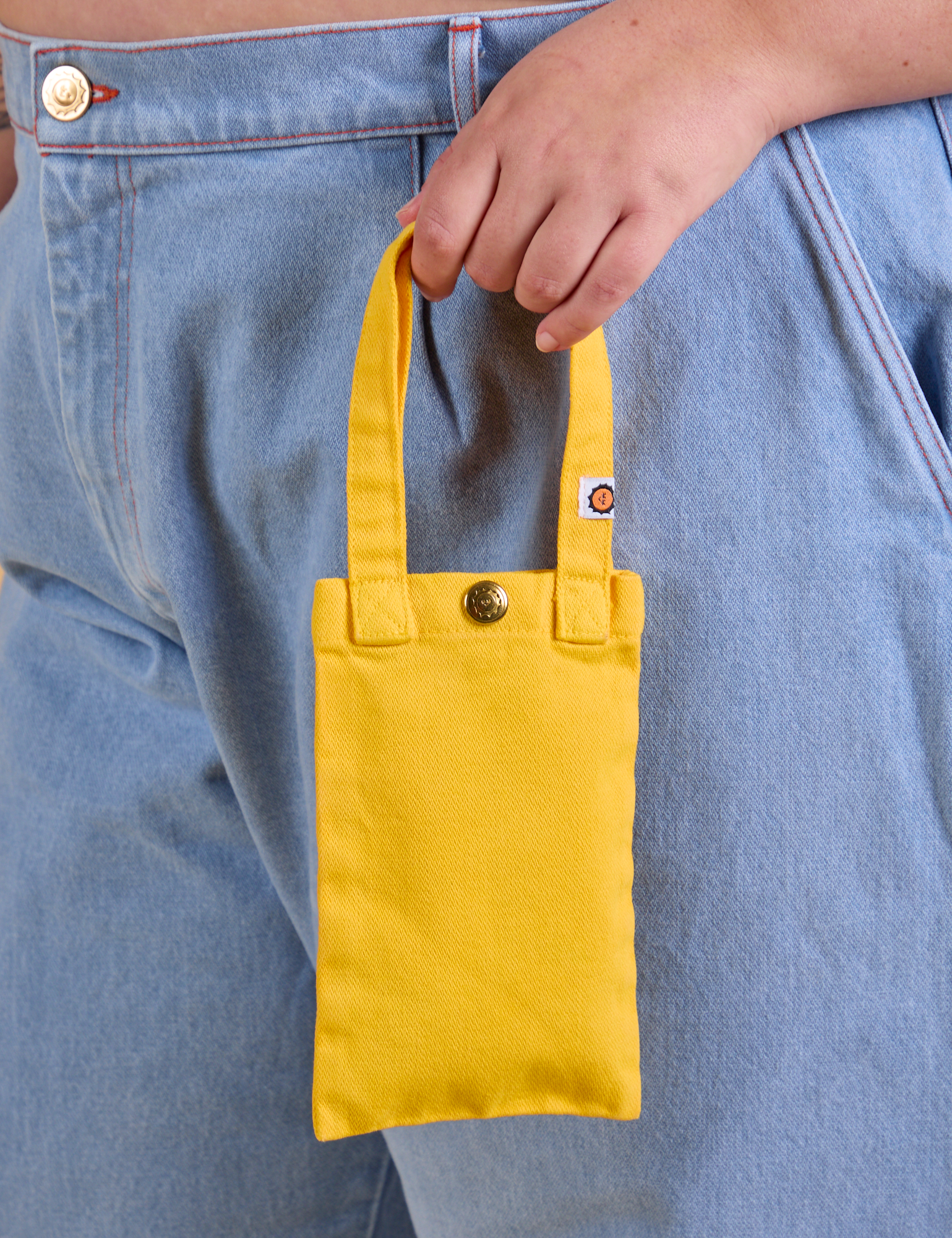 Cell Phone Tote in Sunshine Yellow held by model