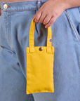 Cell Phone Tote in Sunshine Yellow held by model