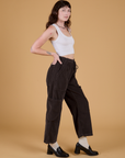 Side view of Corduroy Drop Pocket Cargo Pants in Espresso Brown and Cropped Tank in Vintage Tee White on Alex