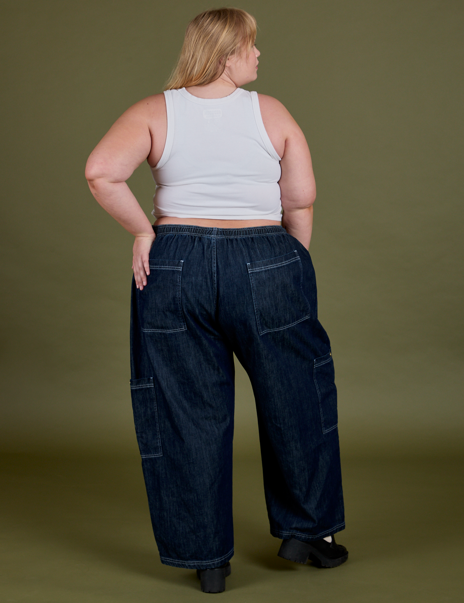 Back view of Denim Drop Pocket Pants in Dark Wash and Cropped Tank in Vintage Tee White on Juliet