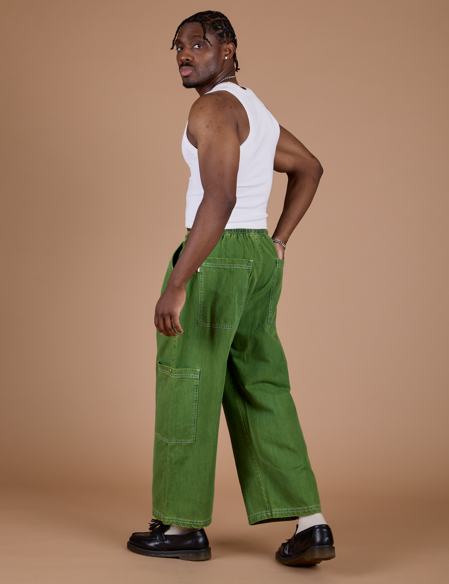 Denim Drop Pocket Pants in Green Overdye angled back view on Isaac