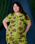 Ashley is wearing a buttoned up Paintstamped Pantry Button-Up in Big Bug