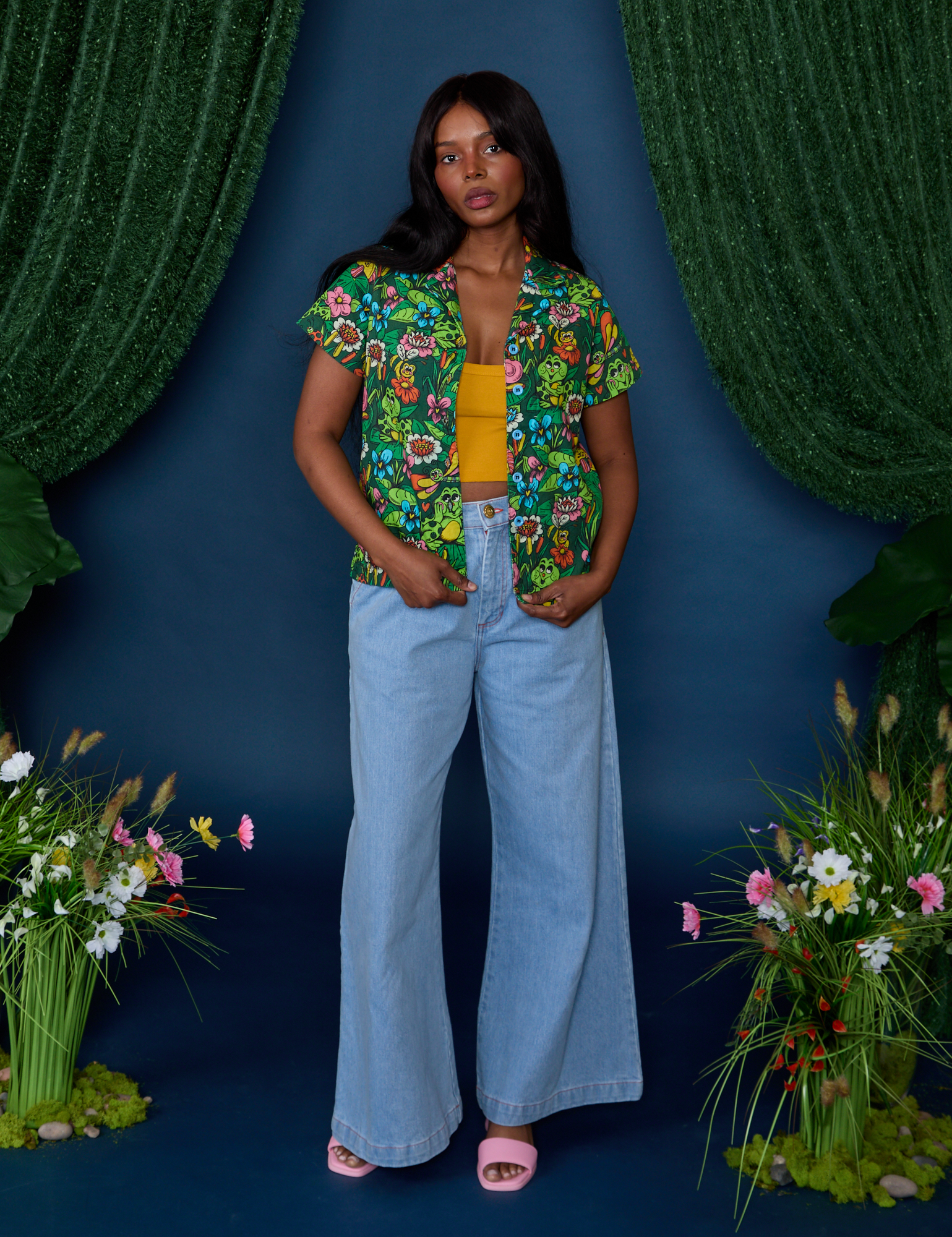 Kandia is wearing Pond Party Pantry Button-Up paired with light wash Indigo Wide Leg Trousers