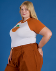 Side view of Produce Raglan Tee in Orange on Juliet