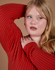 Gingham Long Sleeve Baby Tee in Mustang Red front close up on Juliet
