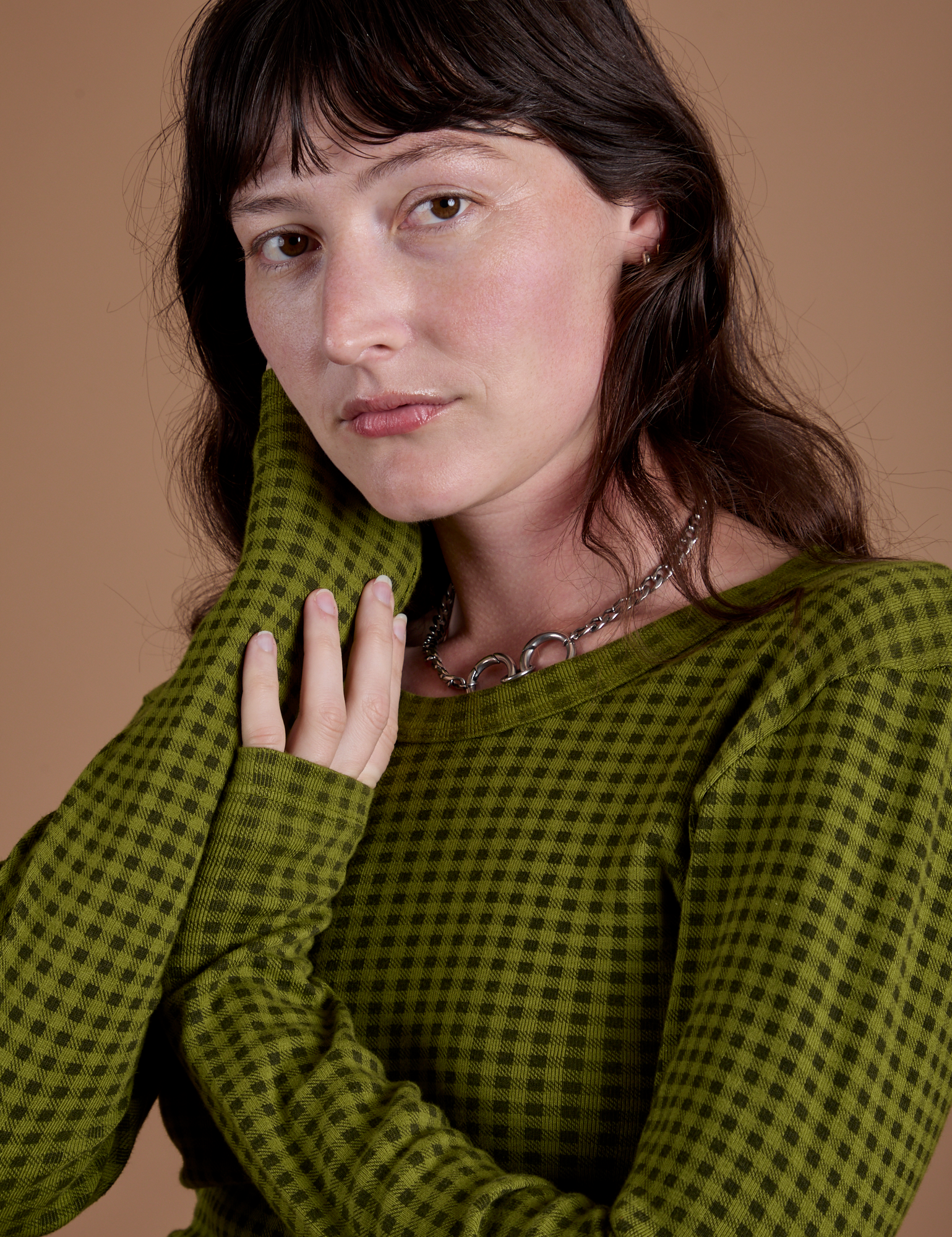 Front close up of Gingham Long Sleeve Baby Tee in Summer Olive on Alex
