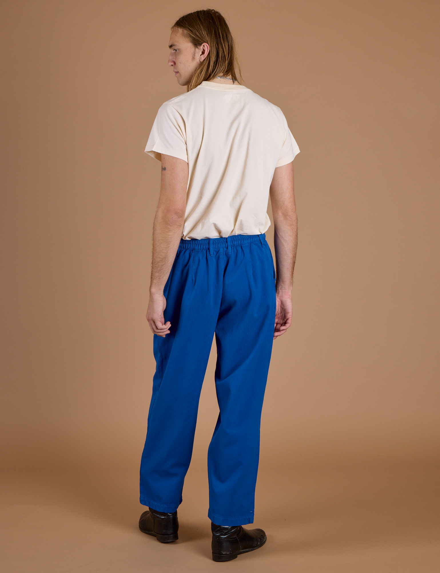 Back view of Heritage Trousers in Royal Blue and Organic Vintage Tee in Vintage Off White
