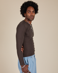 Long Sleeve Baby Tee in Espresso Brown side view on Jerrod