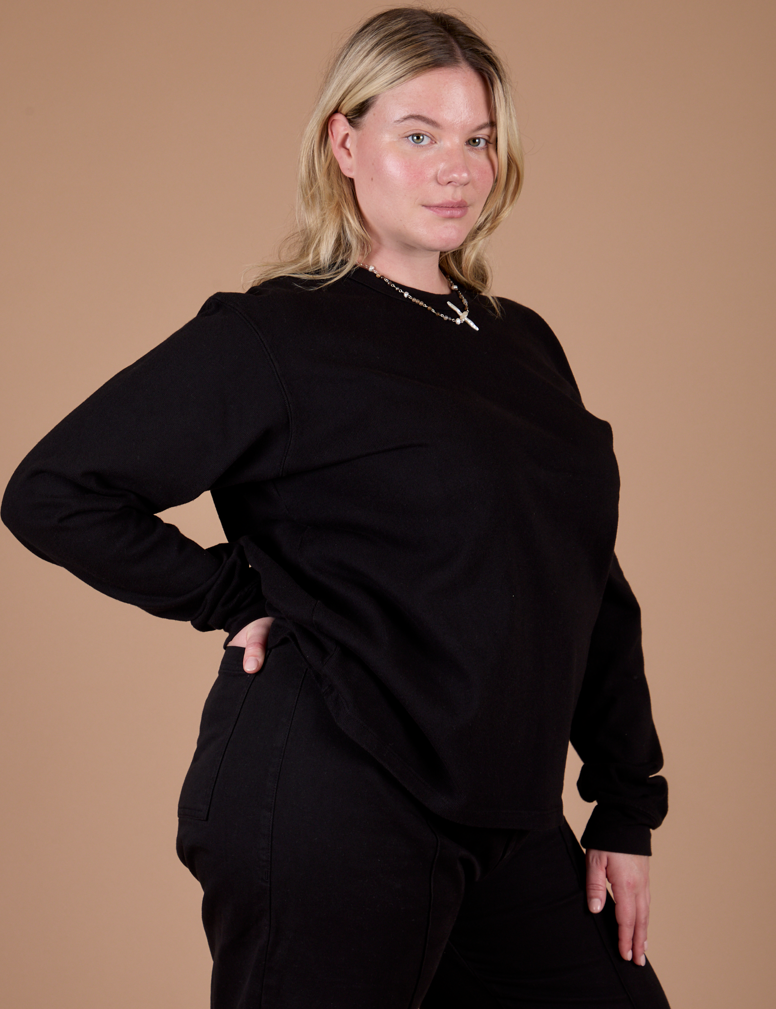 Angled front view of Long Sleeve Burly Tee in Basic Black on Lish