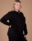 Angled front view of Long Sleeve Burly Tee in Basic Black on Lish