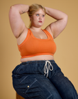 Contrast Stitch Mini Tank in Construction Orange and dark wash Denim Drop Pocket Pants on Juliet