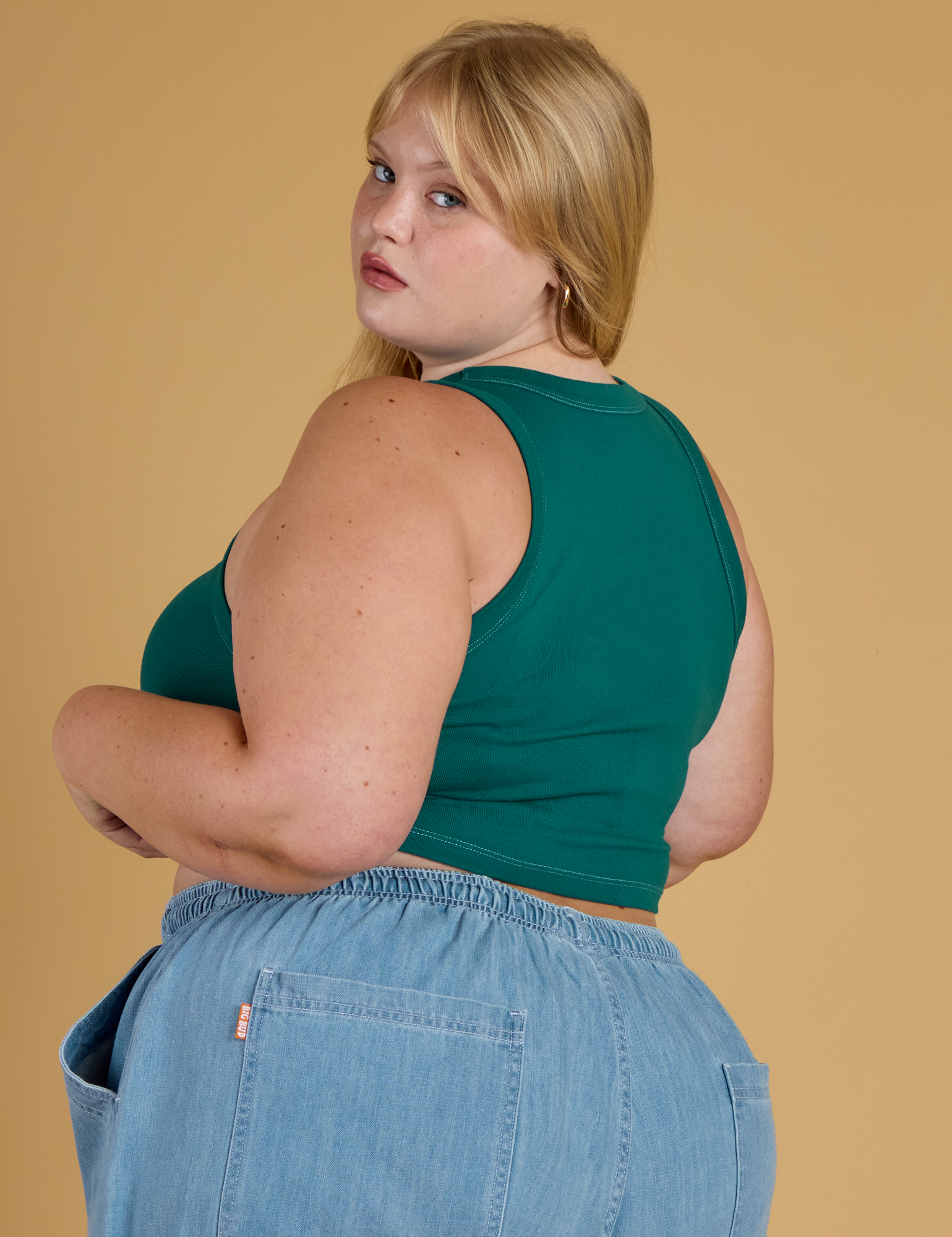 Contrast Stitch Mini Tank in Hunter Green angled back view on Juliet