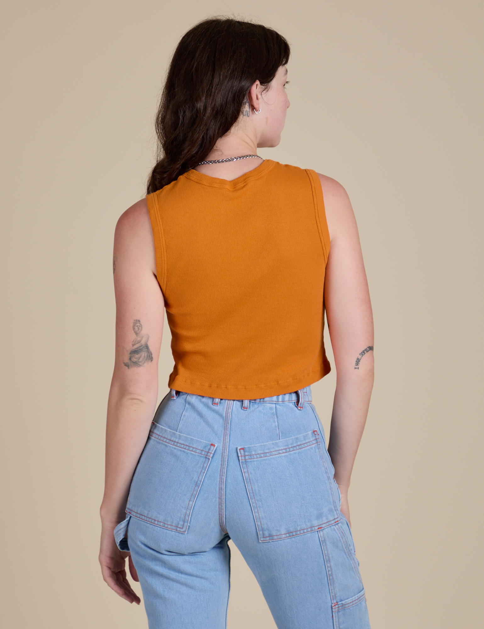 Muscle Tee in Creamsicle Orange back view on Alex