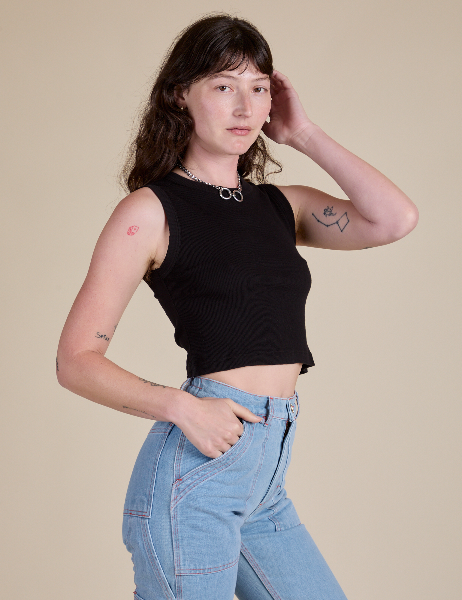 Angled front view of Muscle Tee in Basic Black on Alex