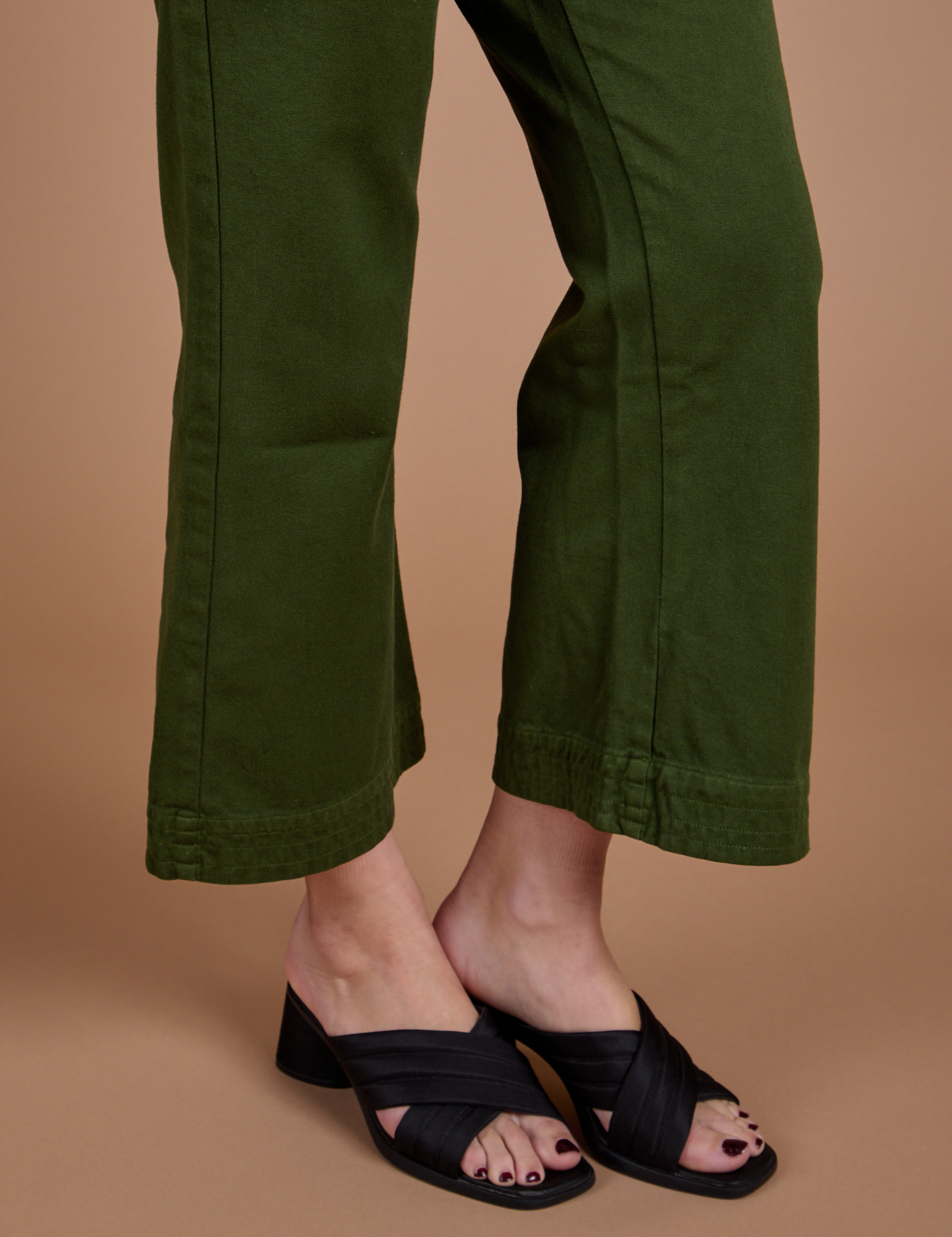 Organic Action Pants in Evergreen pant leg close up on Alex