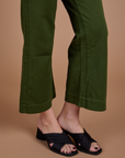 Organic Action Pants in Evergreen pant leg close up on Alex