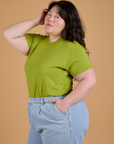 Angled front view of Organic Vintage Tee in Gross Green on Ashley