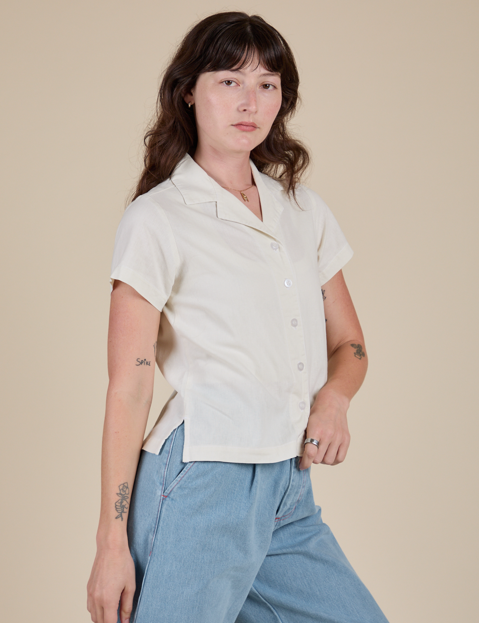 Angled front view of Pantry Button-Up in Vintage Tee White on Alex