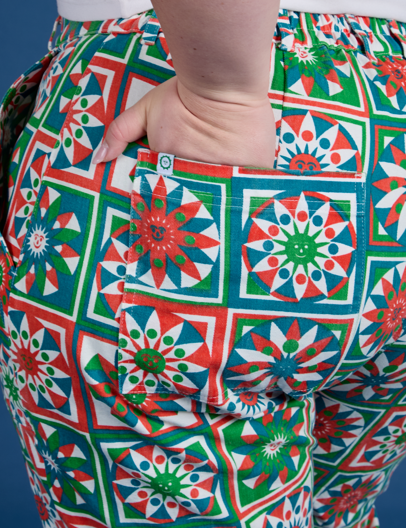 Close up of Ashley's hand in the back pocket of Work Pants in Quilt Print