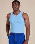 Isaac is 5’10” and wearing S Racerback Tank in Baby Blue