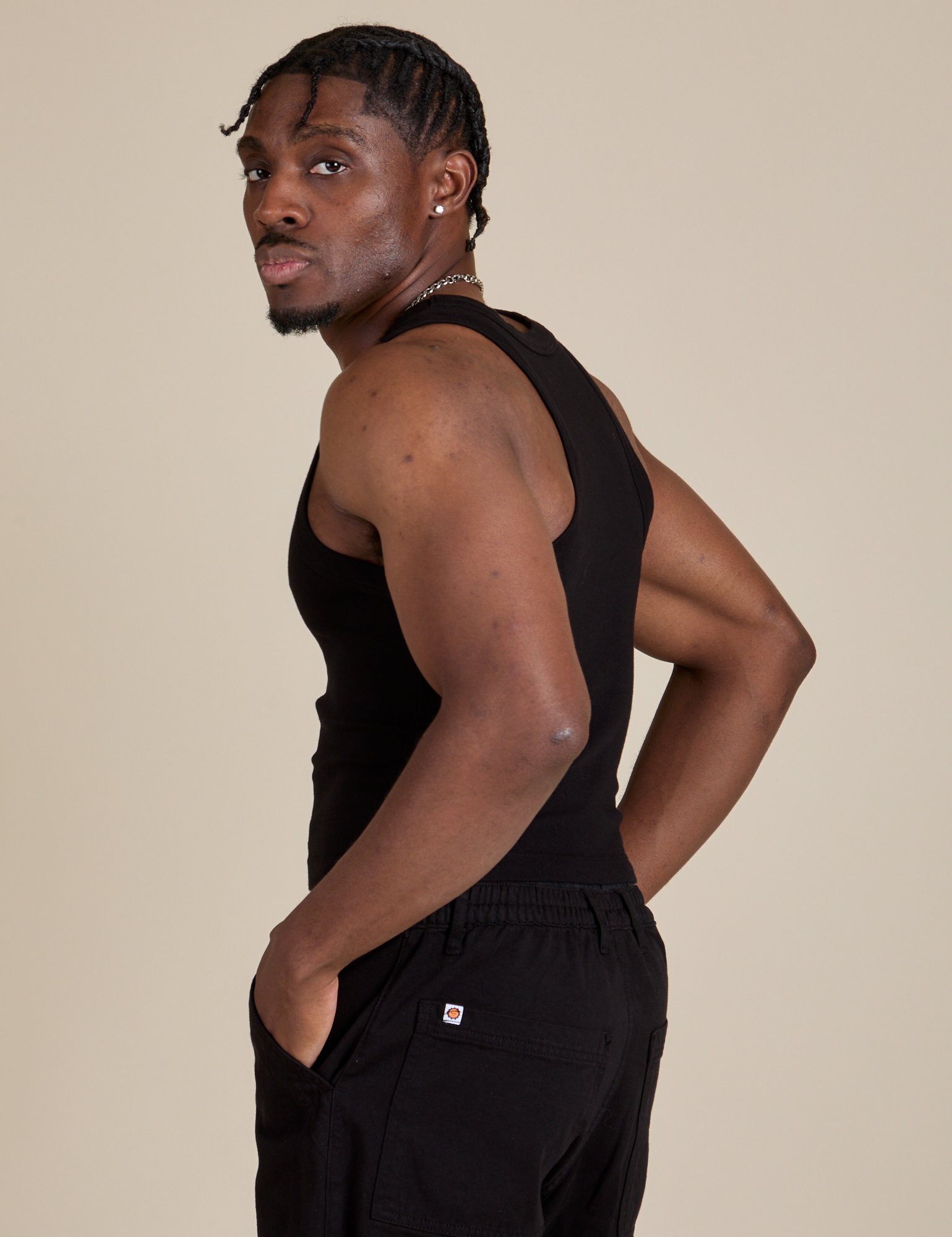 Racerback Tank in Black side view on Isaac