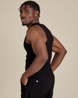 Racerback Tank in Black side view on Isaac