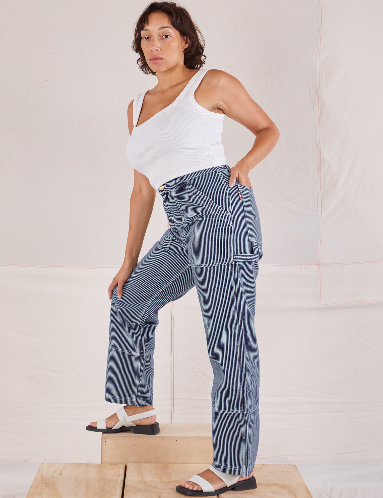 Tiara is wearing Carpenter Jeans in Indigo Railroad and vintage tee off-white Square Neck Tank