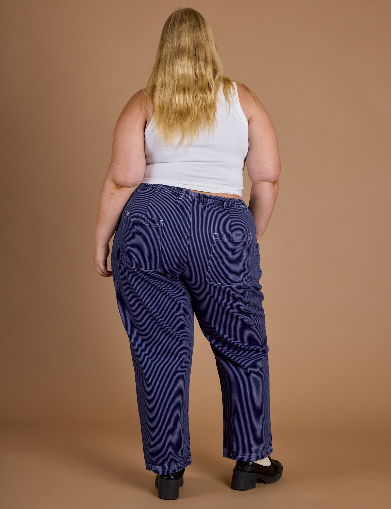Railroad Denim Work Pants in Faded Grape Overdye back view on Juliet