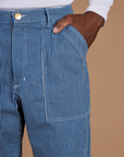 Close up of Isaac's hand in the back pocket of Railroad Denim Work Pants in Natural
