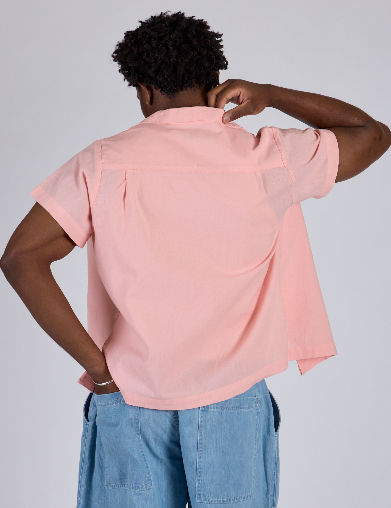 Pantry Button-Up in Baby Pink back view on Isaac