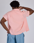 Pantry Button-Up in Baby Pink back view on Isaac