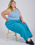 Juliet is wearing Drop Pocket Cargo Pants in Hawaiian Blue and baby blue Racerback Tank