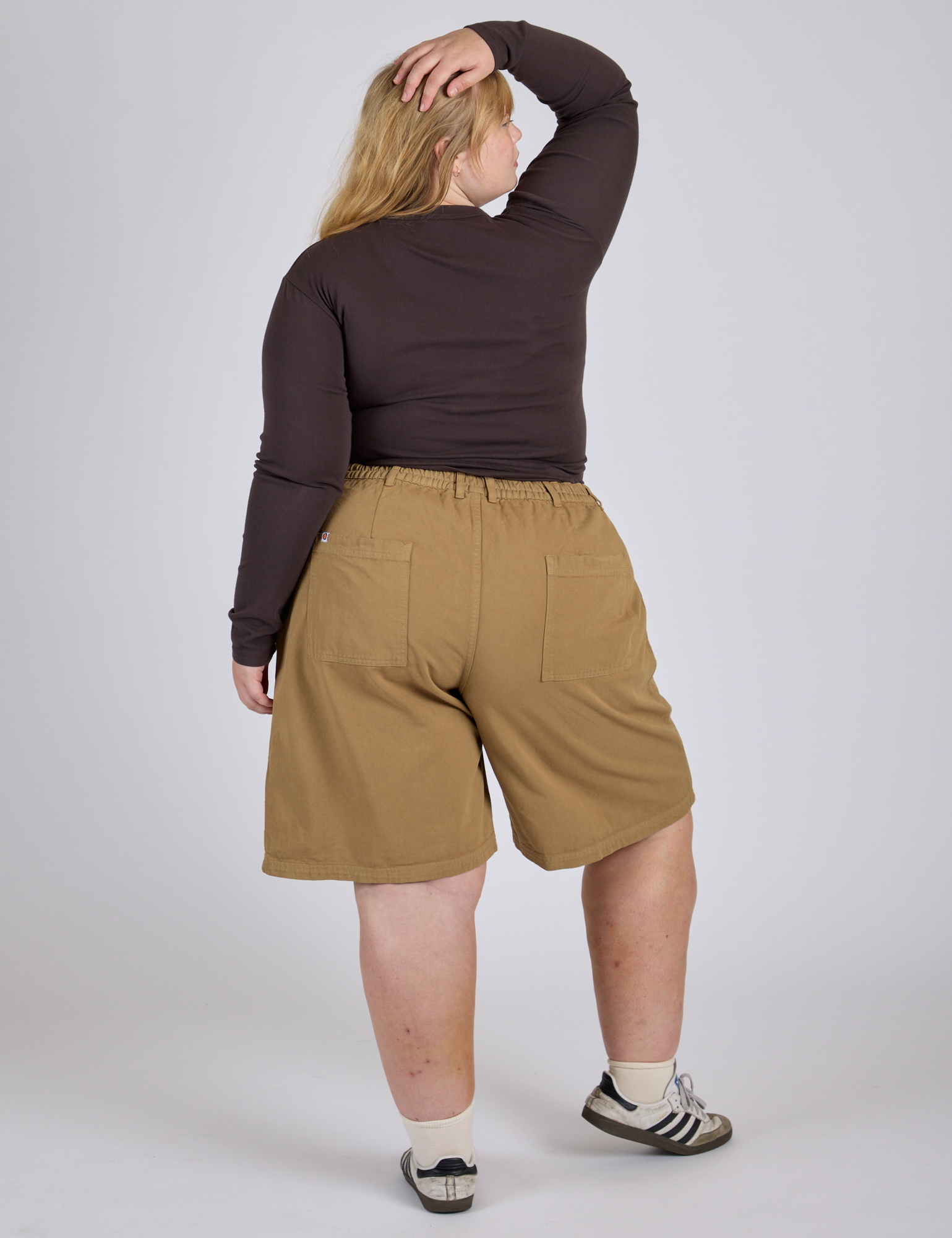 Back view of Longline Work Shorts in Desert Brown and espresso brown Long Sleeve Baby Tee on Juliet