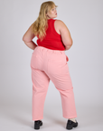Back view of  Work Pants in Baby Pink and mustang red Cropepd Tank 