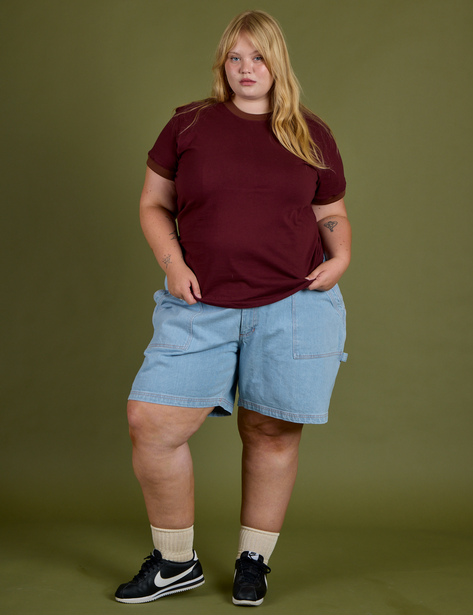 Juliet is wearing Vintage Ringer Tee in Red Wine and light wash Carpenter Shorts