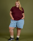 Juliet is wearing Vintage Ringer Tee in Red Wine and light wash Carpenter Shorts