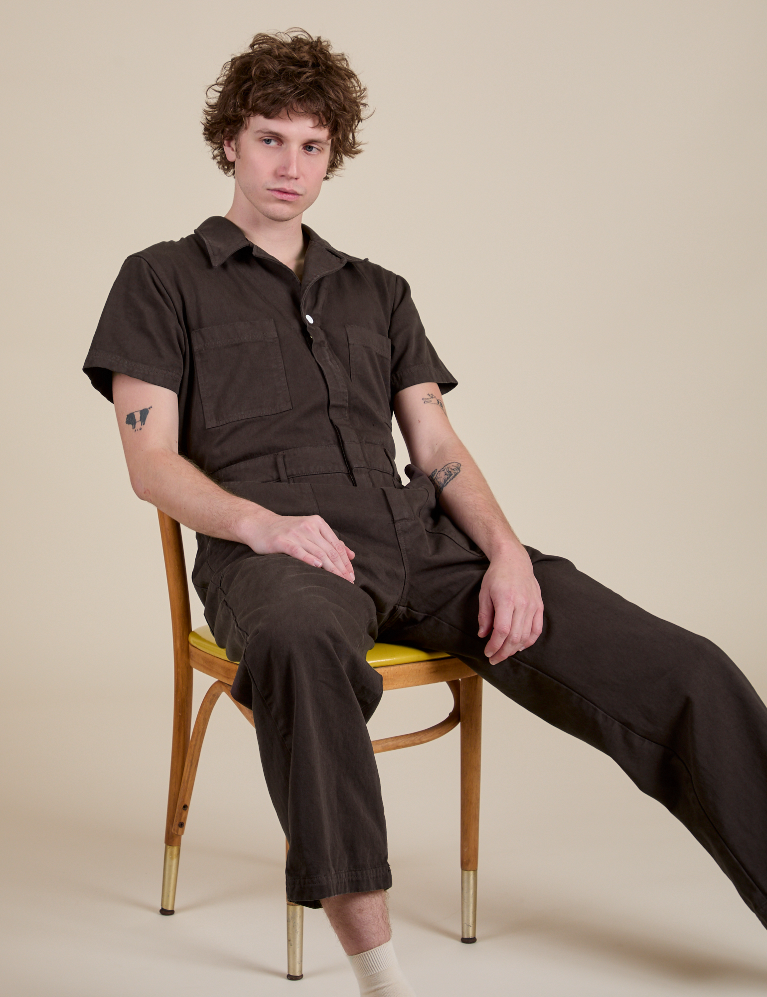 Quinn is wearing Short Sleeve Jumpsuit in Espresso Brown