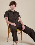 Quinn is wearing Short Sleeve Jumpsuit in Espresso Brown