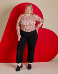 Long Sleeve Baby Tee in Hot Stuff Print and black Western Pants on Juliet