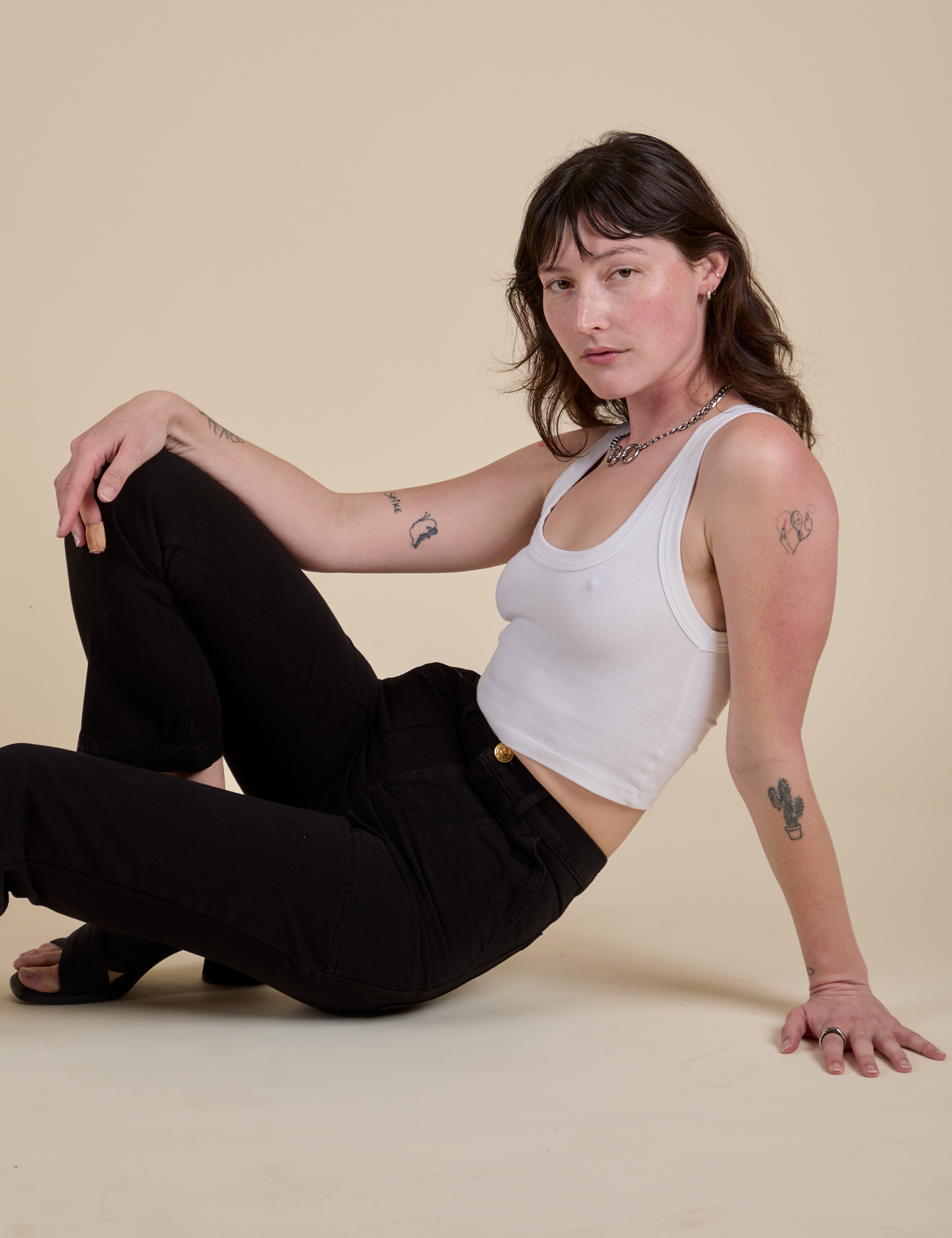 Work Pants in Basic Black and Cropped tank in Vintage Tee White on Alex
