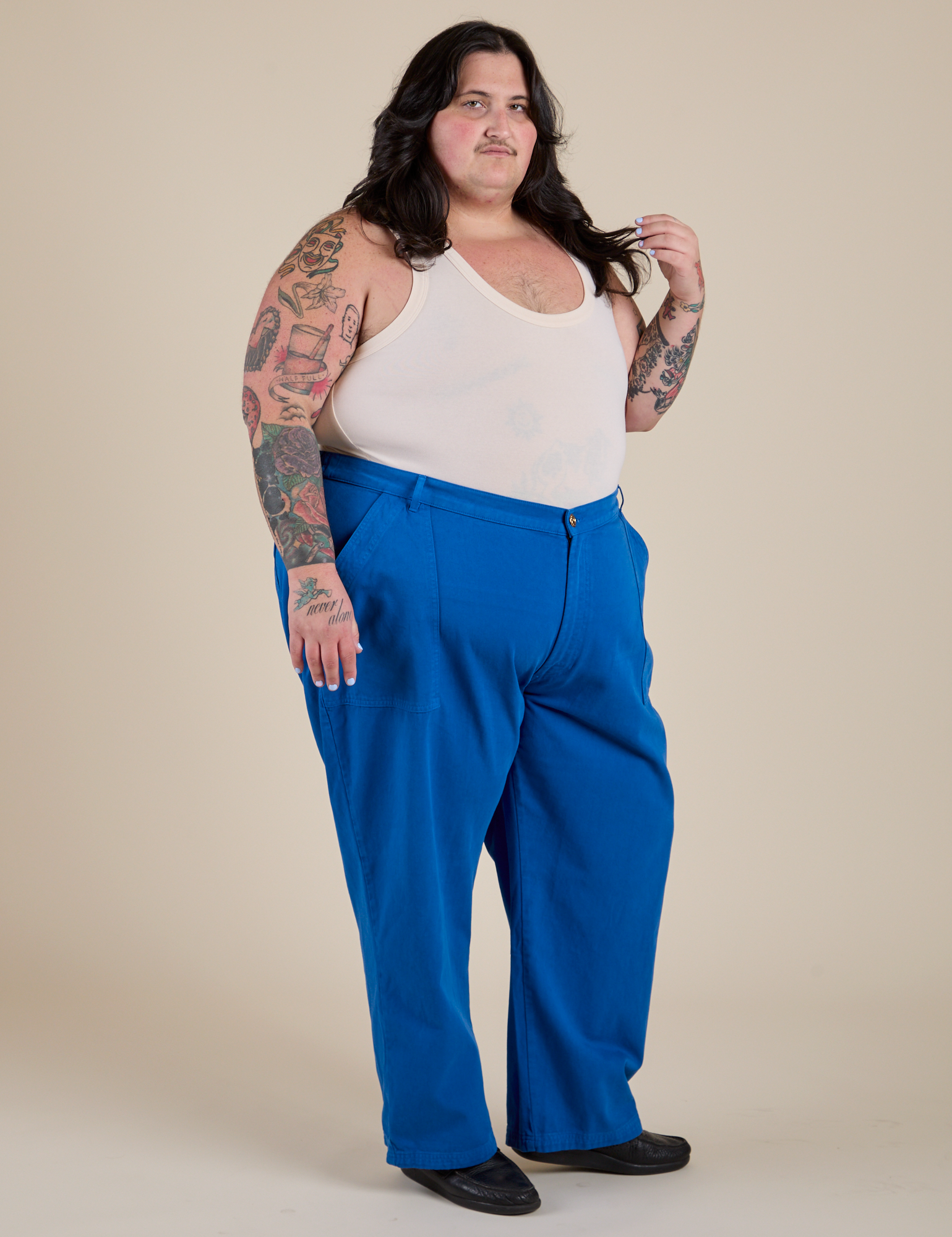 Angled front view of Work Pants in Royal Blue and Tank Top in Vintage Off-Tee White on Sam