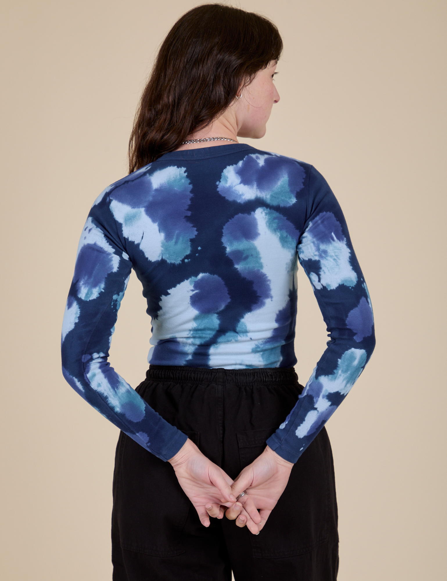 Long Sleeve Baby Tee in Blue Magic Waters back view on Alex